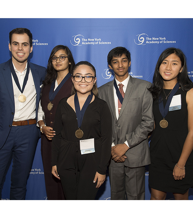 Five high school students pose for the camera.