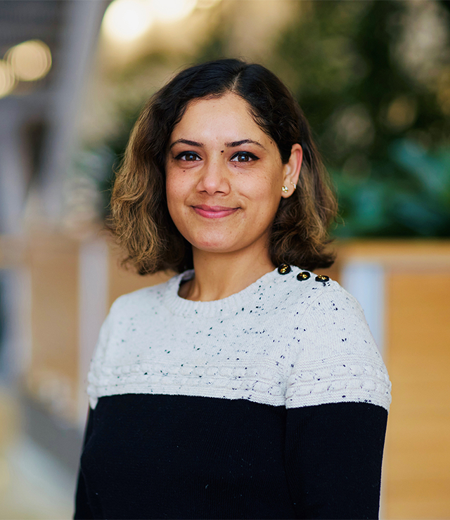 A woman smiles for the camera.