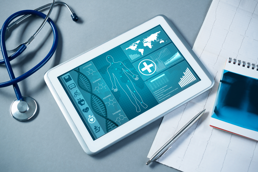 A tablet with a medical application pulled up on the screen.