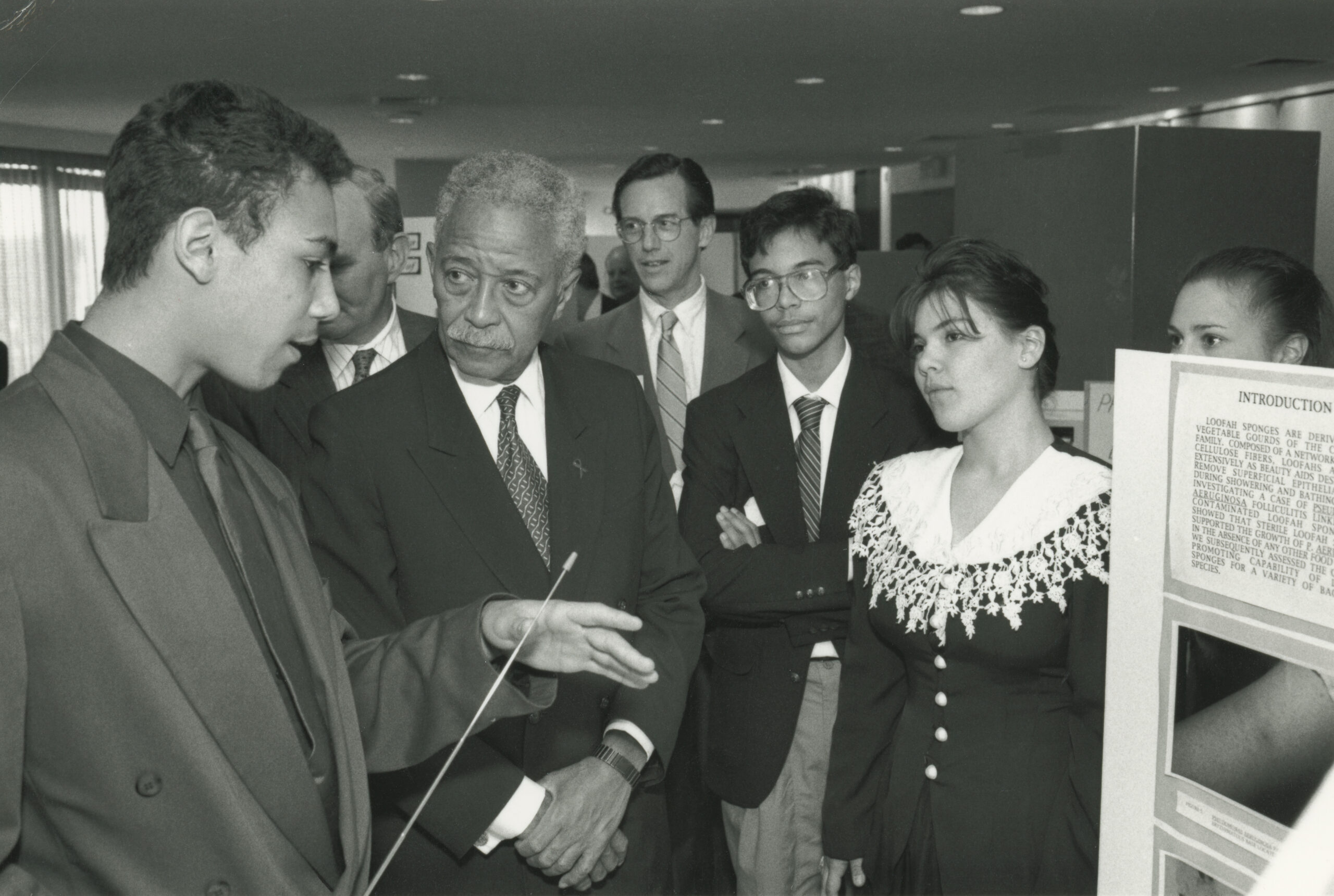 Participants interacting during a 1993 science and technology conference. 