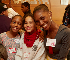 A mentor poses with her two students. 