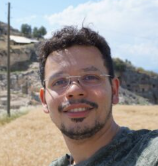 A man smiles for the camera.