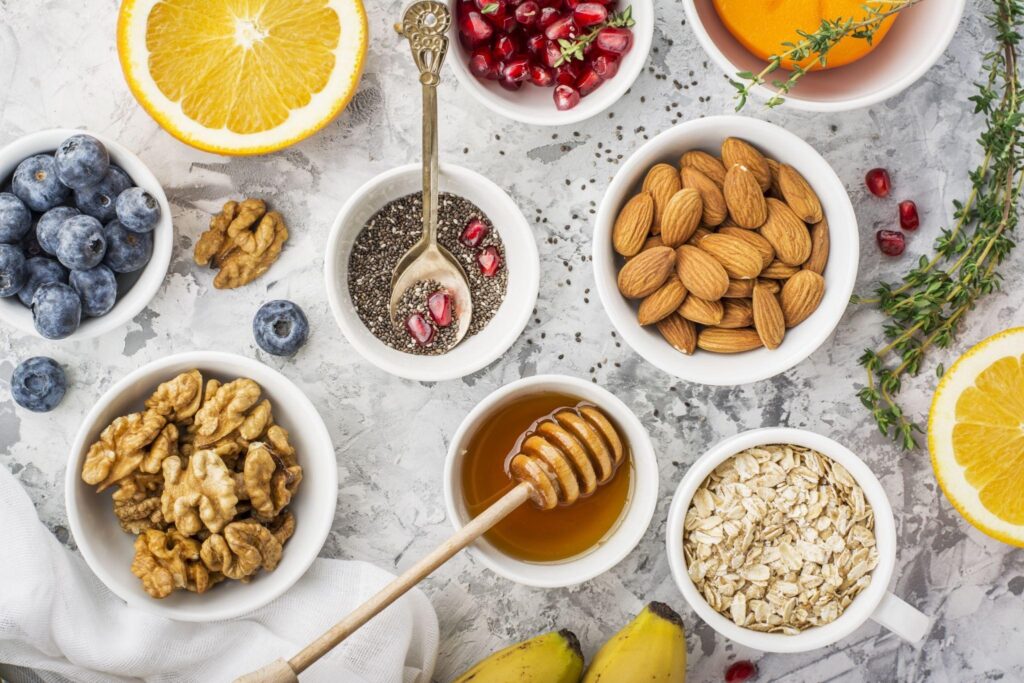 Bowls containing fruits, nuts, and other super foods.