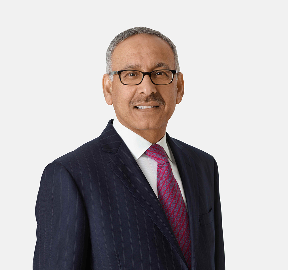 A man in suit and tie poses for the camera.
