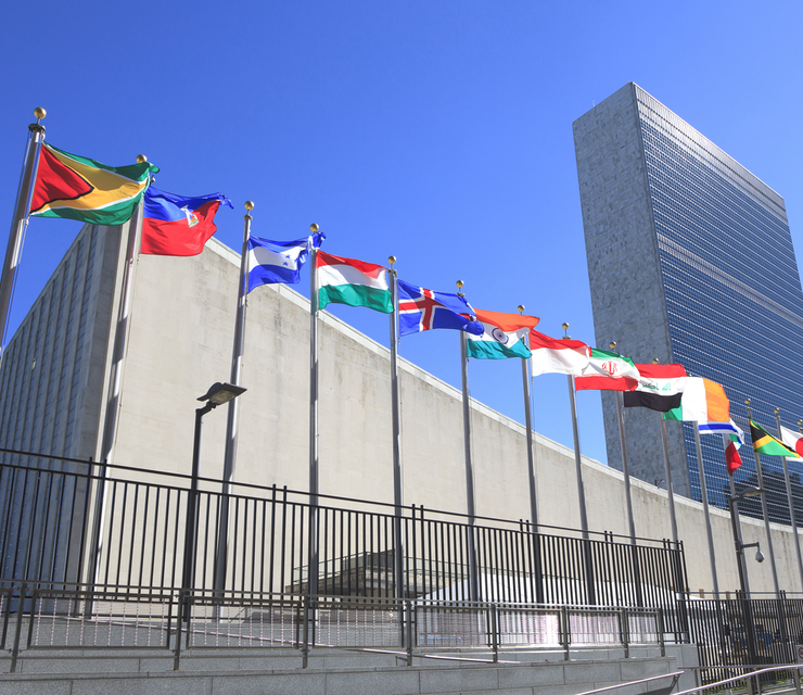Flags for different countries flying outside of the United Nations.