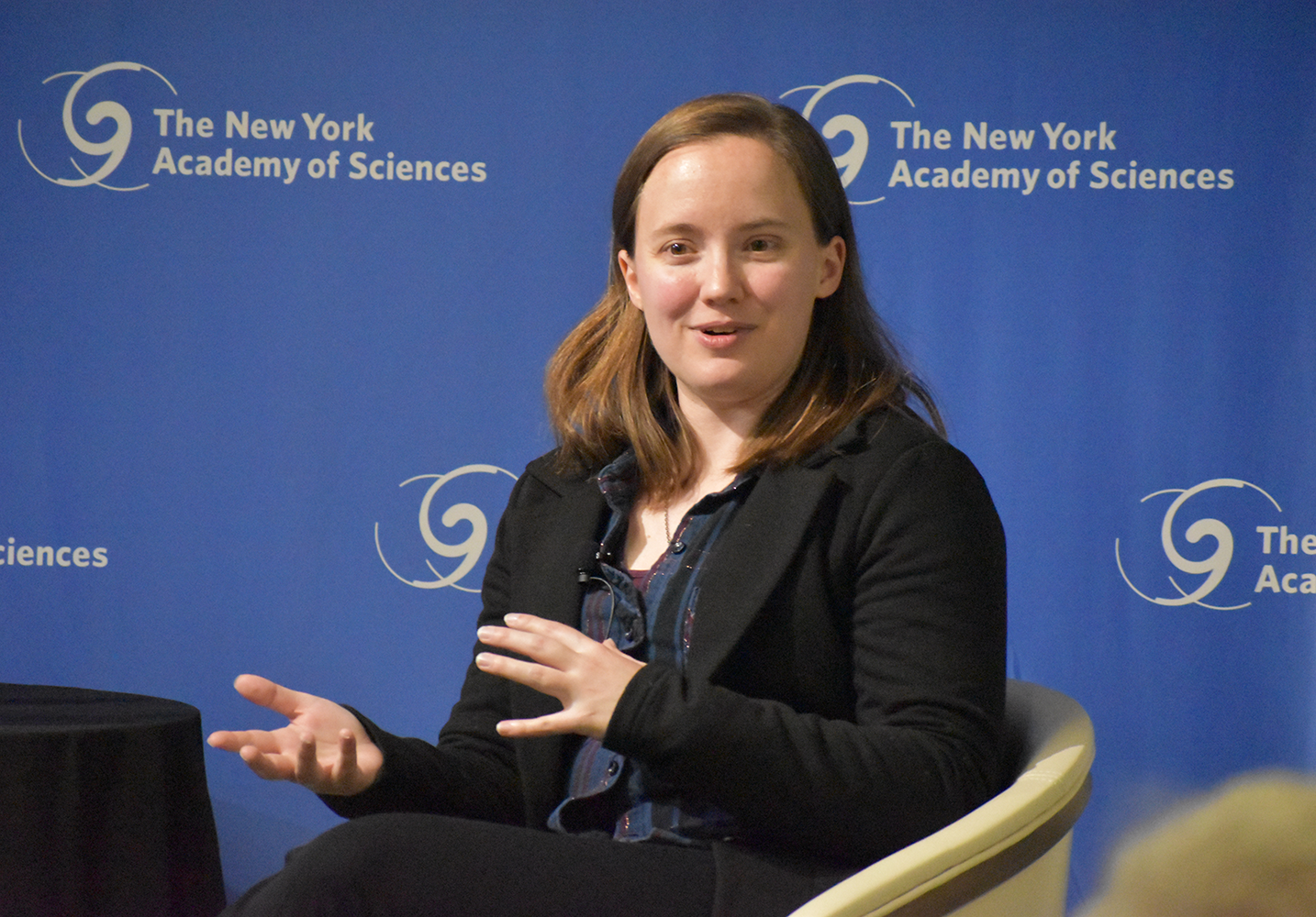 An author presents during an Academy event.