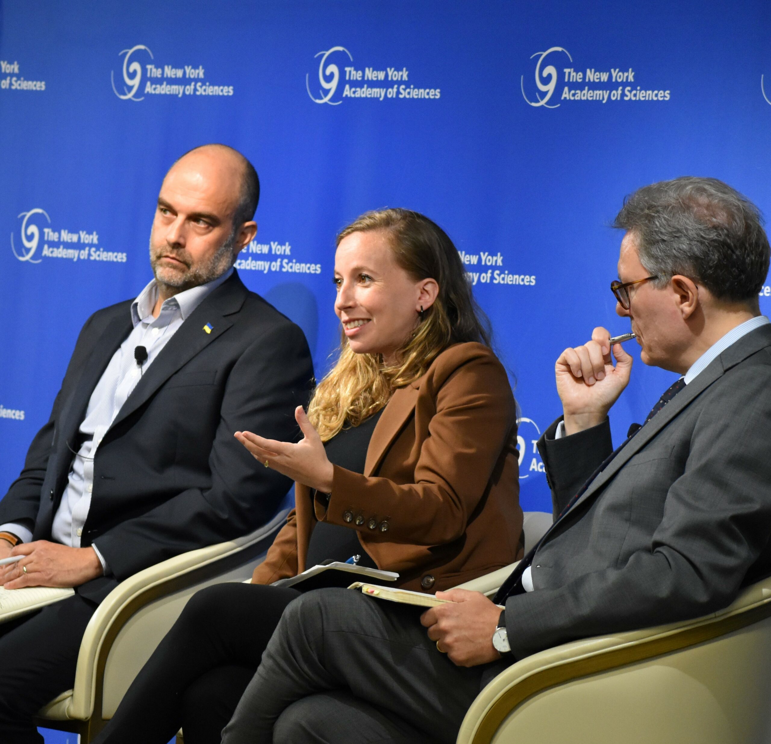 A woman presents during a panel event.