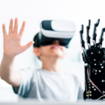 A boy wearing a VR headset, with a robotic hand in the foreground.