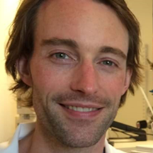 A man smiles for the camera.