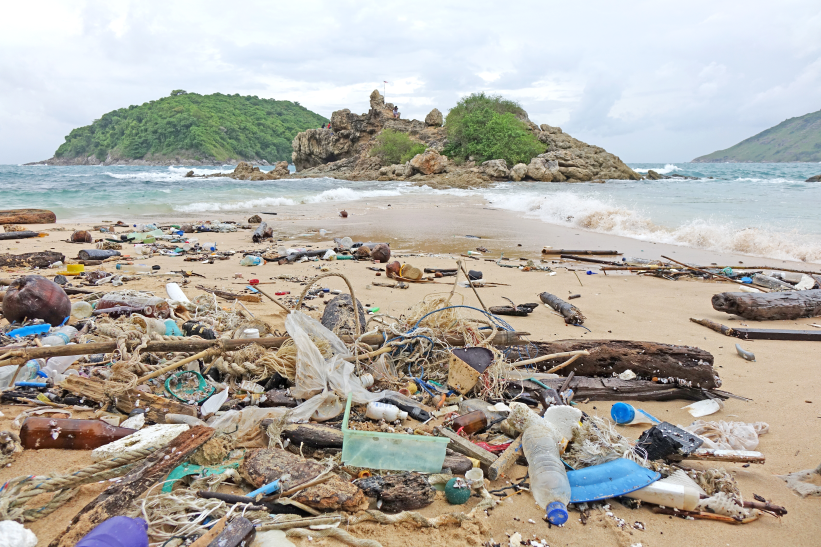 Plastic and other litter on a beach.
