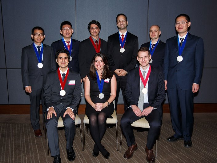 A group shot of honorees pose together.