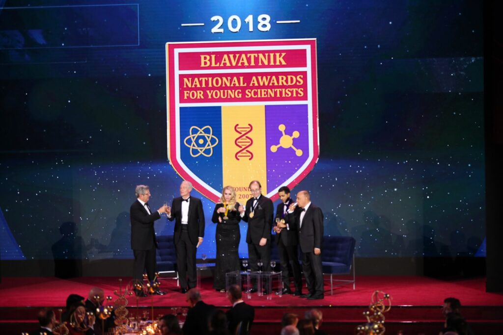 A toast to science as honorees clink their champagne flutes.