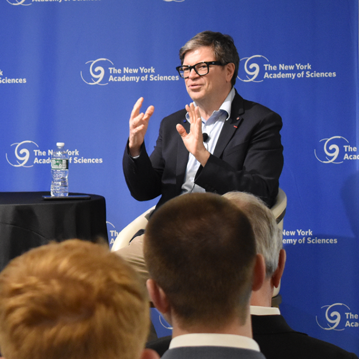 A man gives a talk during an event at the Academy.