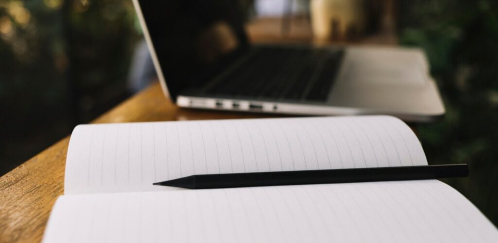An open notebook with blank pages.