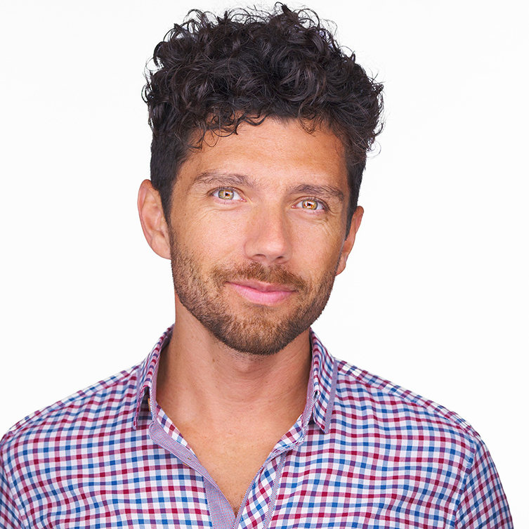 A formally dressed man poses for the camera.